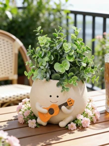 笑脸造型悬挂式花盆，小巧可爱，适合室内/室外植物，可悬挂，尤其适合珍珠吊兰，树脂材质，也可种植多肉植物，是送给女性的理想礼物，也是情人节和生日的绝佳选择。 - 彩色 - 查看 2