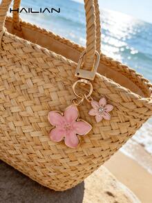 HAILIAN 这款轻巧优雅的樱花造型钥匙扣采用合金材质，专为女性设计，并饰有六瓣樱花吊坠。它是完美的旅行配件，可用作包包挂饰或车钥匙扣，也是情侣生日和节日的理想礼物。 - 粉色 - 查看 4