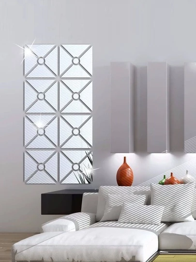 一套5片银色几何组合镜面贴纸，由四个梯形和一个圆形组成，可以组合成一个正方形。这款亚克力材质的镜面墙贴适用于客厅、卧室、厨房和浴室。