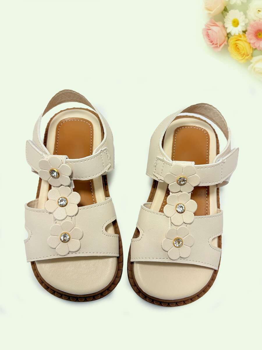Sandalias planas de moda para niñas, decoradas con 3 flores pequeñas, sencillas y versátiles, de moda y cómodas, adecuadas para uso diario, compras, viajes y vacaciones - Beis - Ver 1