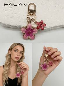1个樱花造型钥匙扣，轻巧优雅的樱花设计，适合挂在包包上，也可作汽车钥匙链，情侣礼物，生日礼物，节日礼物。 - 玫紅色 - 查看 4