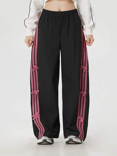  Pantalones deportivos adidas Dance WOVEN PANT de corte holgado para mujer.