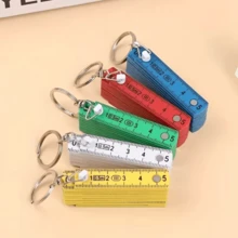 1 pieza Regla plegable multifuncional de plástico ABS, de 10 pliegues, con llavero, compacta y conveniente, herramienta de medición de regla plegable para estudiantes - Multicolor - Ver 1