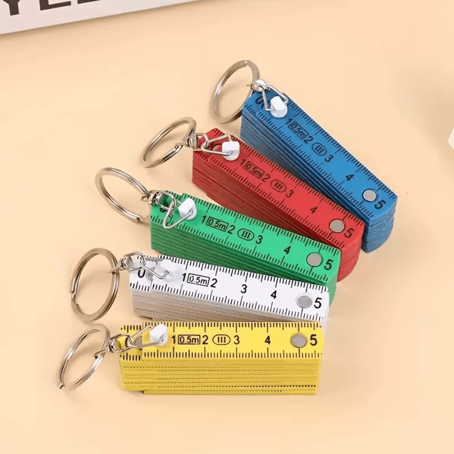 1 pieza Regla plegable multifuncional de plástico ABS, de 10 pliegues, con llavero, compacta y conveniente, herramienta de medición de regla plegable para estudiantes - Multicolor - Ver 1