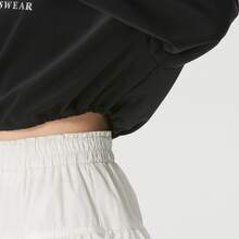 Áo thun dài tay dáng rộng vai rớt, chất liệu cotton nguyên chất, thuộc bộ sưu tập adidas Dance Three Stripes dành cho nữ. - màu đen - Xem 6