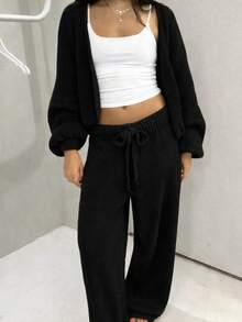 Chic Coordinated Set Of Women's Black Ribbed Sweater With Off-The-Shoulder Top And Long Pants In Comfortable Stretch Fabric - Black - View 2