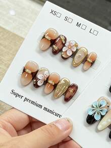 10片纯手工制作的按压式美甲片，长杏仁形，棕色、白色、粉色和金色金属质感，带有立体花朵，可爱精致，Y2K风格，柔和闪光，适合女性和女孩，春夏秋冬，节日和日常生活均可使用。 - 棕色 - 查看 2