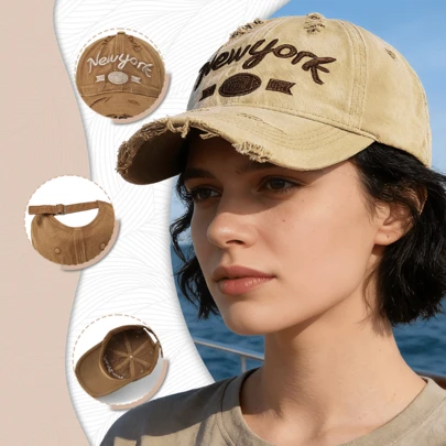 1顶女士纽约棒球帽，做旧毛边设计，刺绣字母，可调节后扣，轻便舒适，完美搭配街头服饰和日常休闲装扮。