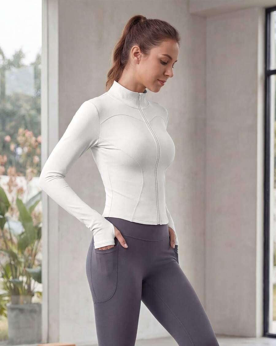 Chaqueta deportiva de manga larga con cremallera de color liso para mujer, corte ajustado y puños con abertura para el pulgar, ideal para fitness, yoga y running. - Blanco - Ver 1