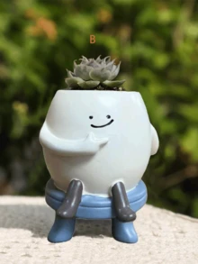 笑脸多肉植物盆栽：一款独特的笑脸造型多肉植物盆栽，底部没有排水孔。这款趣味十足、别具一格的多肉植物盆栽适合室内外装饰。 - 彩色 - 查看 12