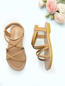 1 đôi dép xăng đan trẻ em màu kaki thời trang, dép xăng đan đế bằng mùa hè cho bé gái, thiết kế quai chéo co giãn, đế mềm chống trơn trượt, thích hợp cho các buổi tiệc, họp mặt, đám cưới, kỳ nghỉ. - Màu Khaki - Xem 5