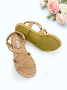 1 đôi dép xăng đan trẻ em màu kaki thời trang, dép xăng đan đế bằng mùa hè cho bé gái, thiết kế quai chéo co giãn, đế mềm chống trơn trượt, thích hợp cho các buổi tiệc, họp mặt, đám cưới, kỳ nghỉ. - Màu Khaki - Xem 6