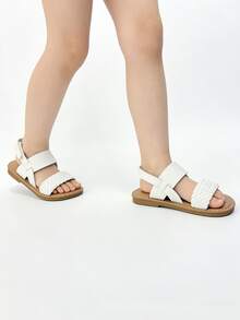 1 đôi dép xăng đan trẻ em màu trắng thời trang, dép xăng đan đế bằng mùa hè cho bé gái, thiết kế quai đan chéo có khóa dán, đế mềm chống trơn trượt, thích hợp cho tiệc chiêu đãi, họp mặt, tiệc cưới, kỳ nghỉ. - trắng - Xem 2