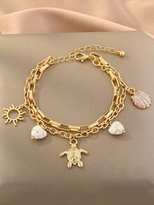 Một chiếc vòng tay chủ đề đại dương với hình sao biển, rùa biển, đá và trái tim. - Nhiều màu - Xem 1