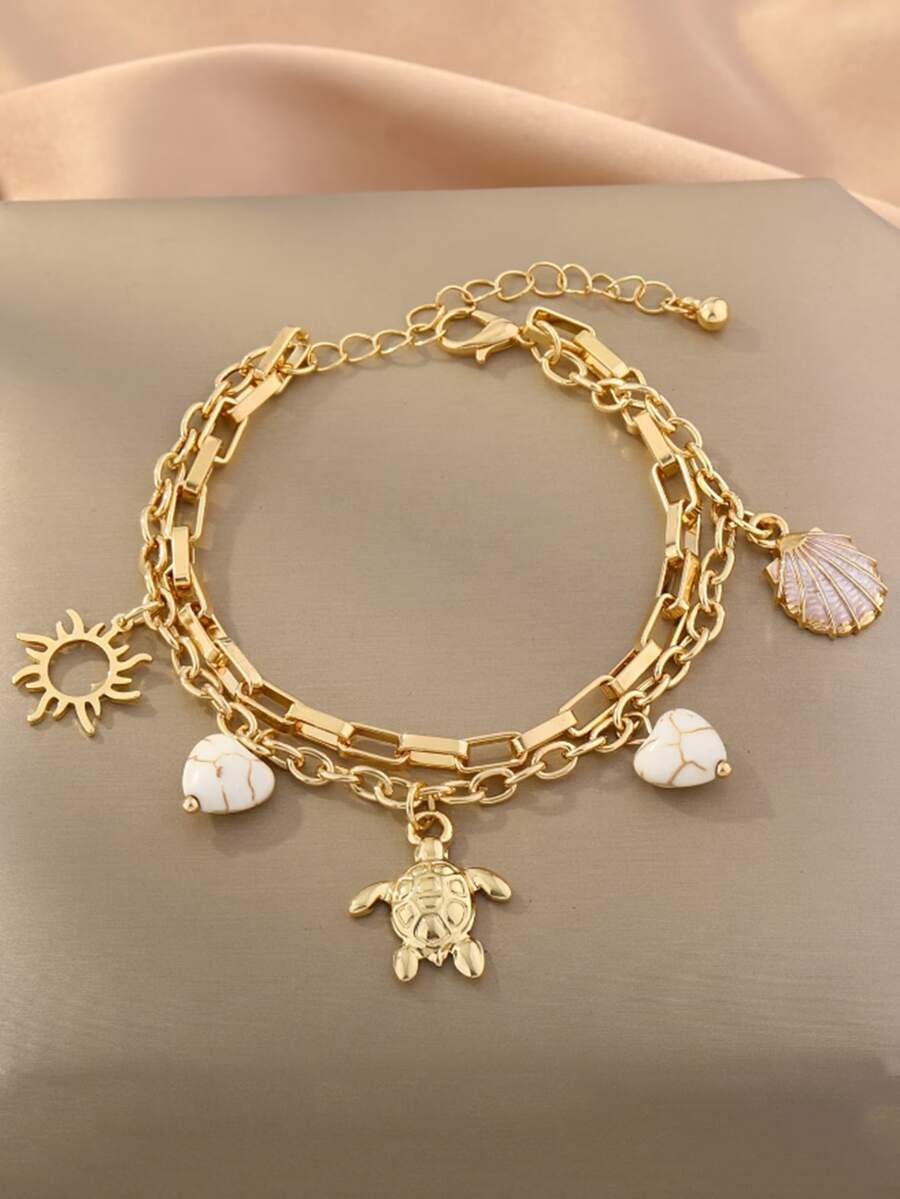 Một chiếc vòng tay chủ đề đại dương với hình sao biển, rùa biển, đá và trái tim. - Nhiều màu - Xem 1