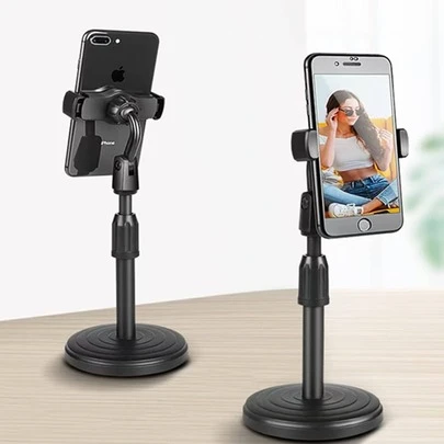 Soporte para teléfono ajustable en altura y ángulo, ideal para el ocio, el trabajo, la oficina y el hogar, compatible con dispositivos de 3,5 a 6,7 pulgadas (negro).Este soporte de teléfono móvil adopta una cabeza esférica giratoria de 360 grados y un ángulo de inclinación de 180 grados hacia adelante y hacia atrás. El ángulo de visión multidireccional reduce la fatiga del cuello y la espalda. Tiene un ángulo más cómodo al ver, leer, estudiar, reproducir, hacer videollamadas o reuniones y puede ajustar la altura. Se puede ajustar fácilmente a su altura preferida usando la barra deslizante suave.