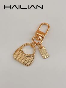 HAILIAN An Alloy Bag Charm Designed In The Style Of A Shoulder Bag, Featuring A Small Square Pendant Inscribed With A Spell. It Serves As A Versatile Accessory-Perfect As A Bag Charm, A Car Key Chain, Or A Small Festive Gift. - Gold - View 3