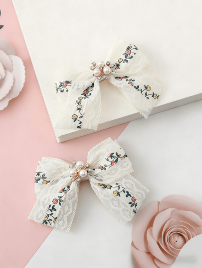Set de 2 pinzas para el cabello de niña con lazo de encaje y estampado floral diminuto