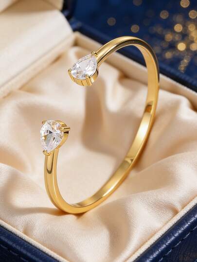 Vòng tay nữ mạ vàng, kiểu dáng hở, đính đá Zirconia hình quả lê, phong cách tối giản thanh lịch, phù hợp cho trang phục đi làm và đi học hàng ngày, món quà lý tưởng cho những người yêu thích thời trang.