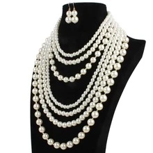 Một chiếc vòng cổ ngọc trai, một đôi bông tai. - Màu be - Xem 4