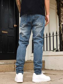 1 chiếc quần jean nam màu xanh denim co giãn, kiểu dáng đường phố năng động, thoáng khí, màu trơn, dáng ôm, phù hợp cho đi dạo phố, các hoạt động ngoài trời cùng gia đình, mọi mùa. - Màu xanh lam - Xem 2