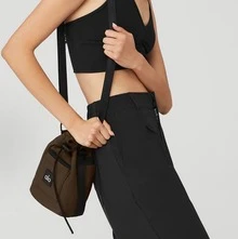 Alo Yoga Utility Cross Body Bucket Bag | Lightweight Water-Resistant Ripstop | Multiple Exterior Zip Pockets | Adjustable Webbing Strap | Cylindrical Silhouette | Functional Street-Ready Accessory - View 2