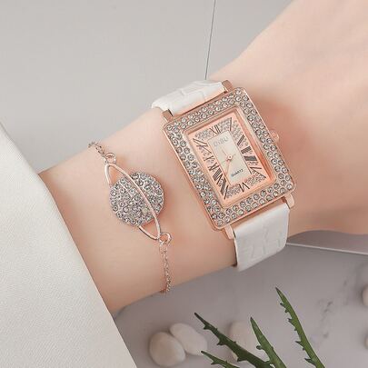 女士白色石英腕表，表盘镶满钻石，奢华优雅，附赠一条表链。适合日常佩戴，也是一份精美的礼物。