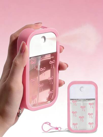 领结图案喷雾瓶，50毫升旅行便携喷雾瓶，硅胶免洗洗手液瓶套，带钥匙扣，全包裹设计，易于使用，柔软硅胶材质，旅行便携，日常必需品，旅行、日常工作、学校必备，配有粉色钥匙扣，方便识别（注：实际产品为空喷雾瓶）