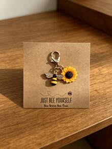 Móc khóa hình hoa hướng dương và ong đầy cảm hứng, thích hợp làm quà tặng cho bạn bè, gia đình hoặc bố mẹ. - Màu vàng - Xem 4