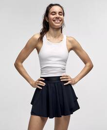 Camiseta de tirantes corta Ebb To Street de Lululemon | Construcción sin costuras | Textura acanalada minimalista | Sujetador incorporado con copas extraíbles | Absorción de humedad y estiramiento en cuatro direcciones | Prenda esencial para ir del estudio a la calle - Blanco - Ver 1