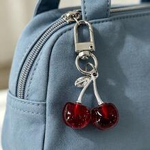 1 pièce Nouveau porte-clés en forme de cerise brillante simulée pour femmes, chaîne de sac/téléphone mode délicate en 3D avec fruit, joli charm de sac en forme de cerise, pendentif de fruit en acrylique frais, porte-clés de cerise douce, décoration de téléphone suspendue en métal doré girly. Cadeau pour mère, père, remise de diplôme et enseignant - Rouge foncé - Voir 1