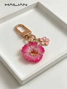 HAILIAN Llavero con flor linda, colgante de bolso de resina de hibisco con degradado y mini flor colgante, llavero chapado en oro, adecuado para billetera, mochila, bolso de mano, decoración de llaves de coche, gran regalo para mujeres y niñas (disponible en rosa/rojo) - Rosa Fucsia - Ver 10