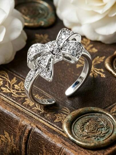 1 chiếc nhẫn đồng có thể điều chỉnh kích thước, thiết kế nơ, đính đá Cubic Zirconia, màu bạc, thích hợp làm trang sức dự tiệc.