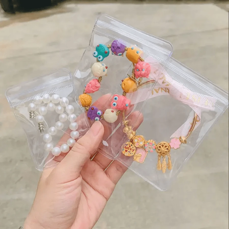 100个透明PVC首饰收纳袋，小型可重复密封拉链袋，适用于耳环、项链、戒指、手镯等，防氧化塑料袋，带密封盖，可用于收纳首饰、珠子、小饰品，透明整理袋，适合旅行和居家使用。