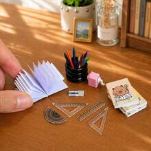 Miniature Dollhouse Study Accessories And Drawing Set. This Set Of Mini Stationery Includes A Miniature Notebook, Ruler, Protractor, Colored Crayons, Eraser, Pencil Sharpener, And A Pen Holder Model. - one-size - View 3