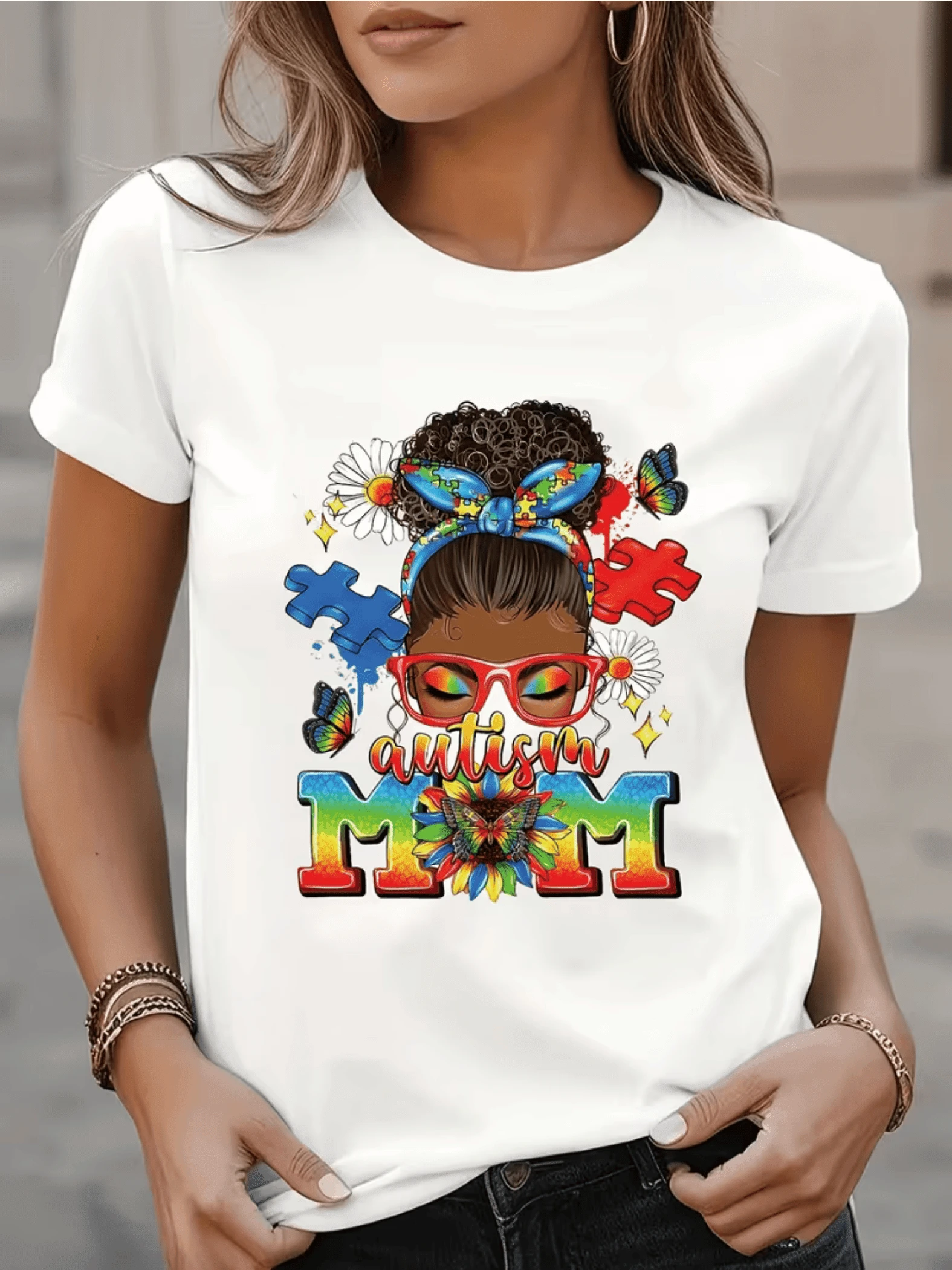 Woman With Curly Hair Adorned With A Puzzle Piece Bow Surrounded By Flowers And Butterflies Symbolizing Diversity, Love, And Family Connection. Comfortable Casual Women's T-Shirt For Everyday Wear. - 白色 - 查看 1