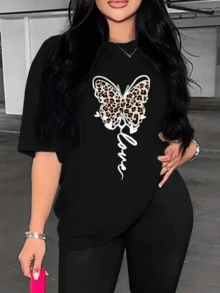 Mariposa con patrón de leopardo que simboliza la libertad la fuerza interior y la transformación personal inspirando confianza y energía positiva camiseta de mujer cómoda y moderna para uso diario - Negro - Ver 8