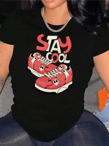 Two Red Sneakers With Small Skulls Reflect A Rebellious Attitude And Youthful Energy, Accompanied By Large Lettering That Inspires Confidence And Modern Style On This Comfortable, Casual Women's T-Shirt For Everyday Wear. - 黑色 - 查看 1