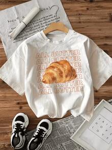 Croissant dorado que simboliza la calidez de una mañana tranquila y el placer de disfrutar un desayuno delicioso con aroma mantecoso camiseta de mujer casual cómoda para uso diario - Blanco - Ver 1
