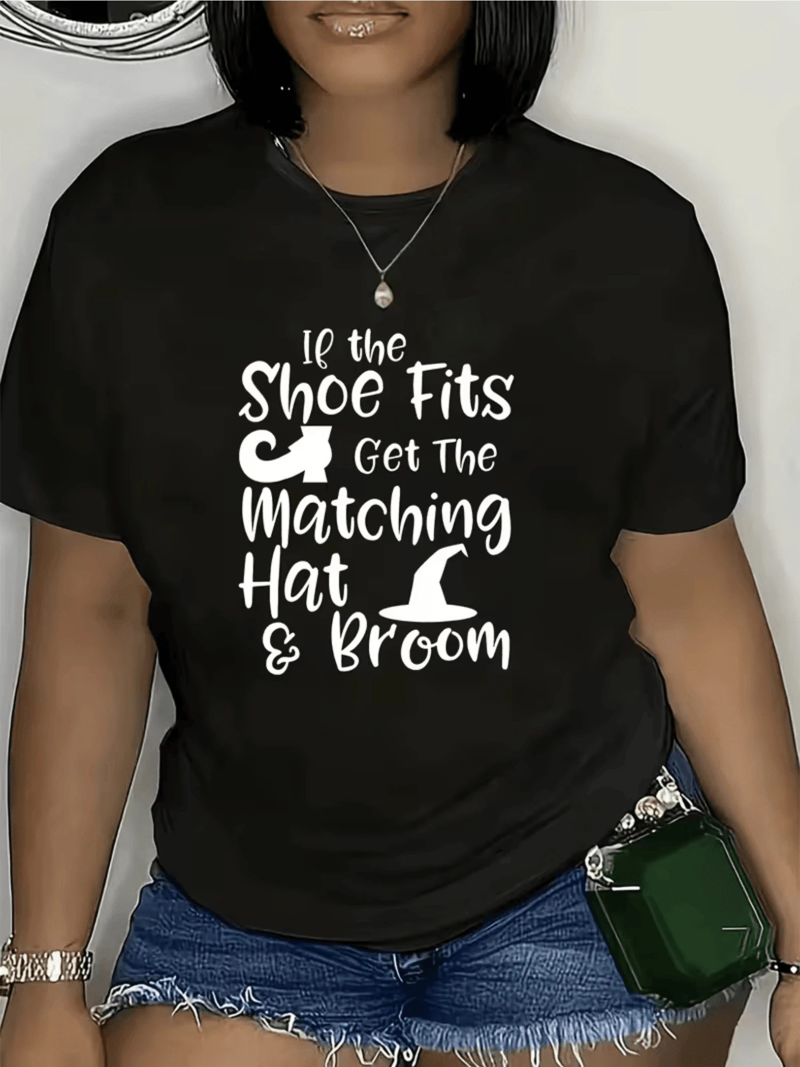 Magic Hat With Boots And Broom Symbolizing Fun Humor And Bold Feminine Energy With Prominent Large Lettering, Casual Women's T-Shirt For Summer - Hitam - View 1