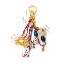 1 chiếc móc khóa phong cách đại dương thời trang, kiểu Bohemian, mặt dây chuyền hình cua vàng, sao biển và vỏ sò, thích hợp cho túi xách, ba lô, túi trang điểm, vali, móc khóa, phụ kiện dệt. - Nhiều màu - Xem 8