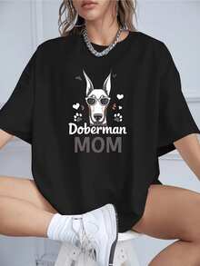 Figura de un dóberman con gafas rodeado de huellas y corazones que simboliza el amor y orgullo de una madre por su mascota camiseta de mujer casual cómoda para uso diario - Negro - Ver 8