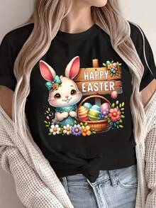An Adorable Pink-Eared Rabbit Holds An Egg Next To A Wooden Sign Surrounded By Colorful Flowers And A Basket Full Of Decorated Eggs, Conveying Easter Joy. A Comfortable, Modern Women's Casual T-Shirt For Celebrations. - 黑色 - 查看 8