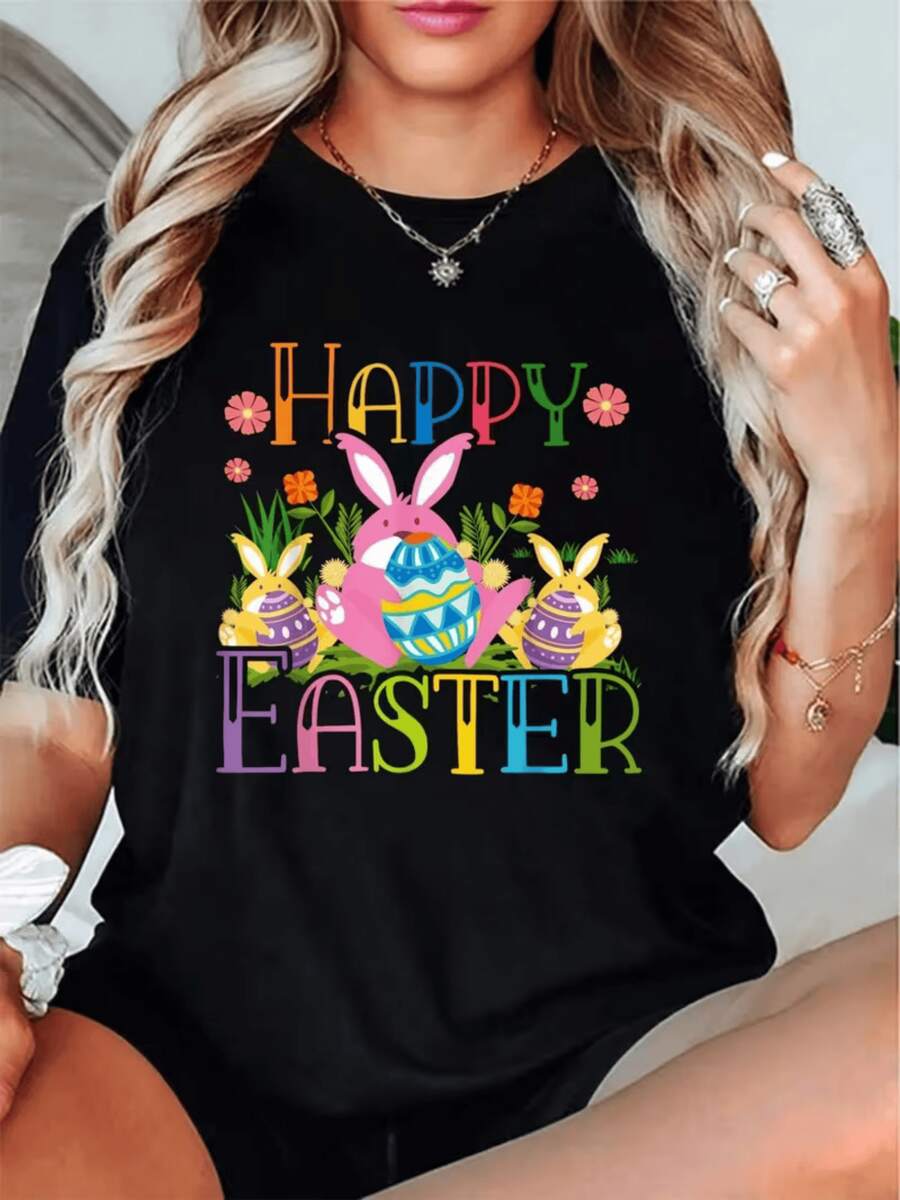 Coloridos conejos sosteniendo huevos decorados rodeados de flores simbolizan alegría y renovación celebrando Pascua camiseta de mujer casual cómoda para fiesta y uso diario - Negro - Ver 1