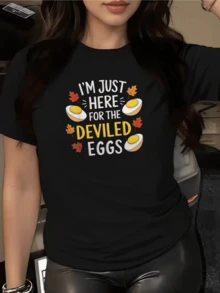 Hojas de otoño y huevos dorados simbolizan la calidez familiar y la alegría de compartir momentos únicos con humor festivo camiseta de mujer casual cómoda y moderna - Negro - Ver 1