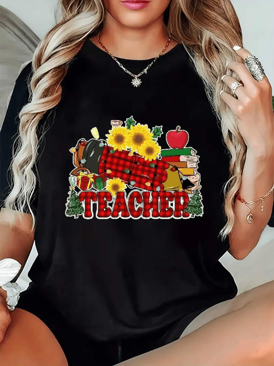 Sunflowers Alongside Books, Apples, And A Mug Celebrate The Teacher's Dedication With A Warm And Cheerful Touch That Inspires A Love Of Learning. A Comfortable And Modern Casual Women's T-Shirt For Everyday Wear. - 黑色 - 查看 1