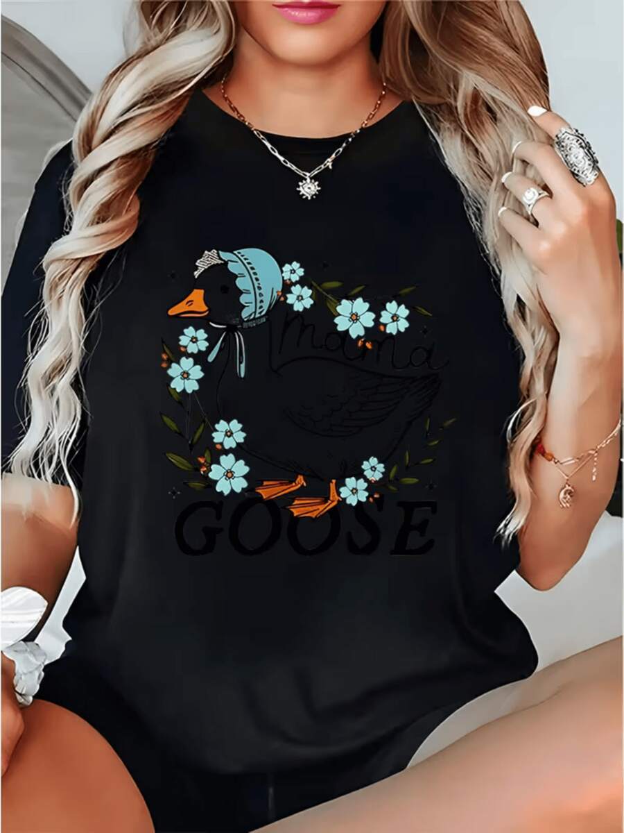 Goose With A Blue Hat Surrounded By Light Blue Flowers Symbolizing Tenderness And Tranquility, Conveying A Sense Of Calm And Joy. Comfortable And Modern Casual Women's T-Shirt For Everyday Wear. - 黑色 - 查看 1