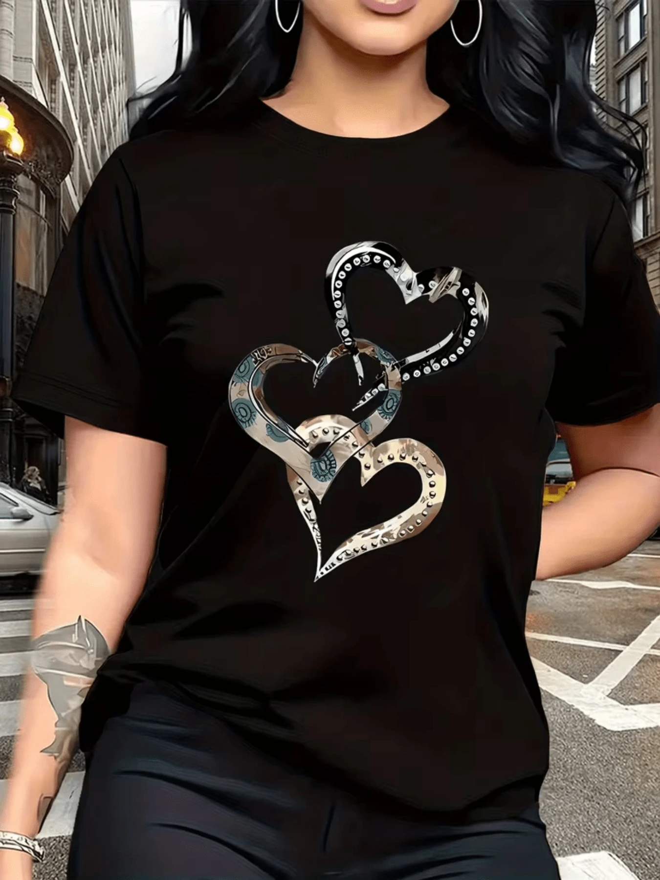 Intertwined Hearts Decorated With Metallic Shapes And Circular Details Symbolize Unity, Strength, And Elegance, Reflecting A Deep And Modern Connection. Casual Women's T-Shirt For Everyday Wear. - Hitam - View 1