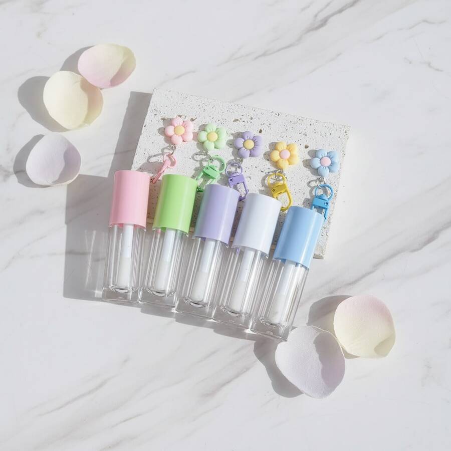 1 cái hộp đựng son bóng rỗng 6ml màu hồng, trắng, tím, xanh lá cây, xanh dương, có cọ lớn, kèm ống đựng son bóng và dầu dưỡng môi, có móc khóa hình hoa. - Nhiều màu - Xem 1
