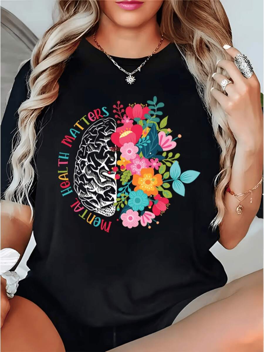 Mitad cerebro formado por líneas intrincadas y mitad llena de flores coloridas que simbolizan equilibrio entre mente y naturaleza camiseta de mujer para expresar bienestar emocional y energía positiva - Negro - Ver 1
